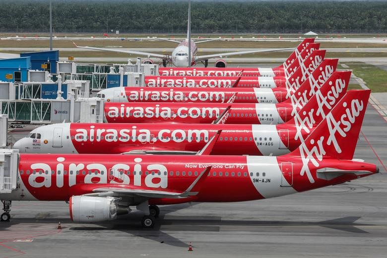 Featured Post Image - Tata Sons dalam pembicaraan untuk membeli saham AirAsia India dengan diskon besar: Laporan